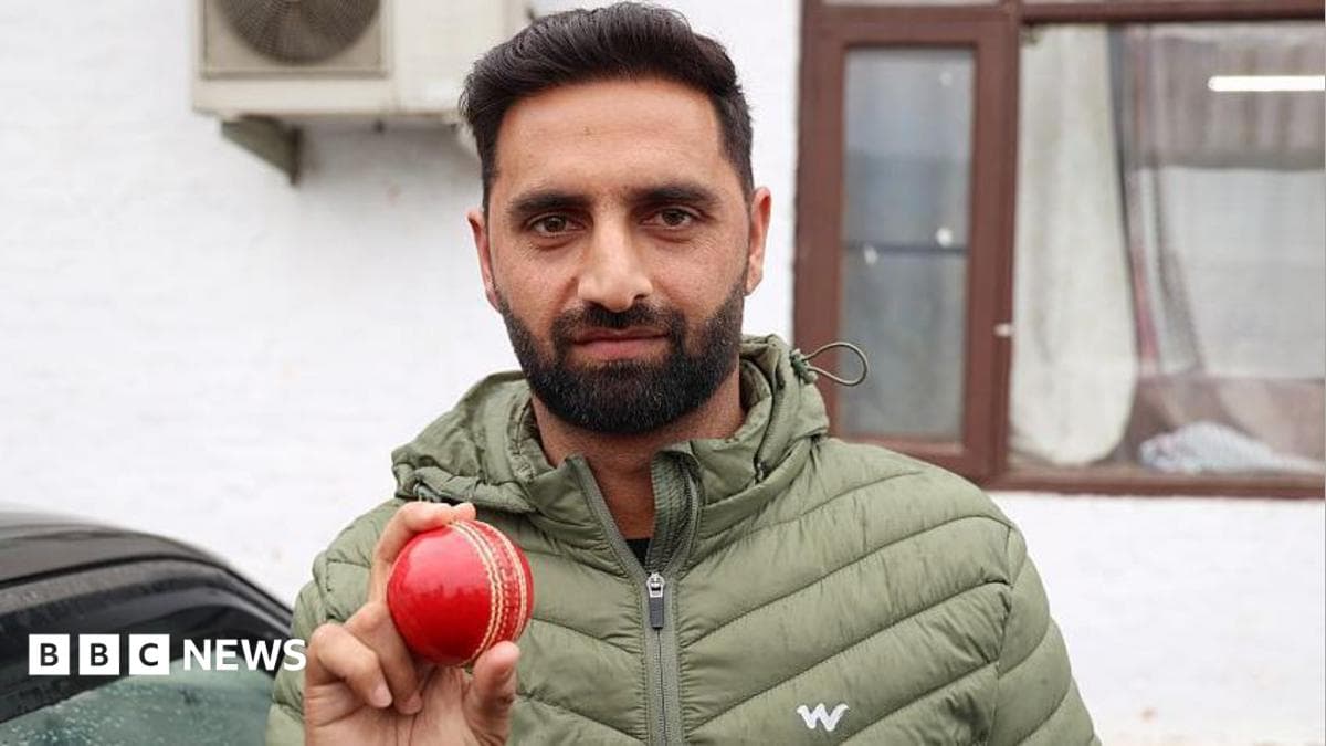 Auqib Nabi Dar poses with a red cricket ball in Baramulla, Jammu and Kashmir, India, on March 18, 2026. Auqib Nabi Dar is an Indian cricketer who plays as a right-arm medium bowler. He represents Jammu & Kashmir in domestic cricket and Delhi Capitals in the Indian Premier League. (Photo by Nasir Kachroo/NurPhoto via Getty Images)