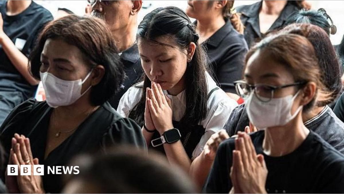 Mourners pray for the 12-year-old who died after being shot at the school outside Bangkok