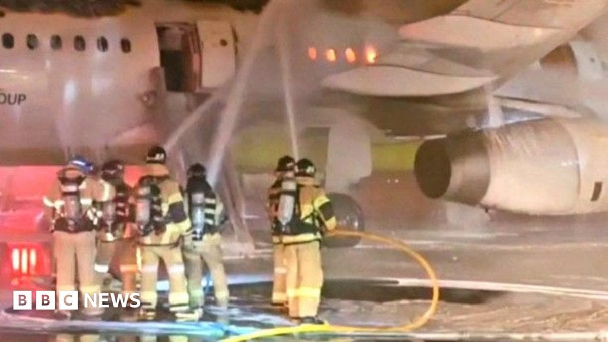 Firefighters tackle an aircraft fire