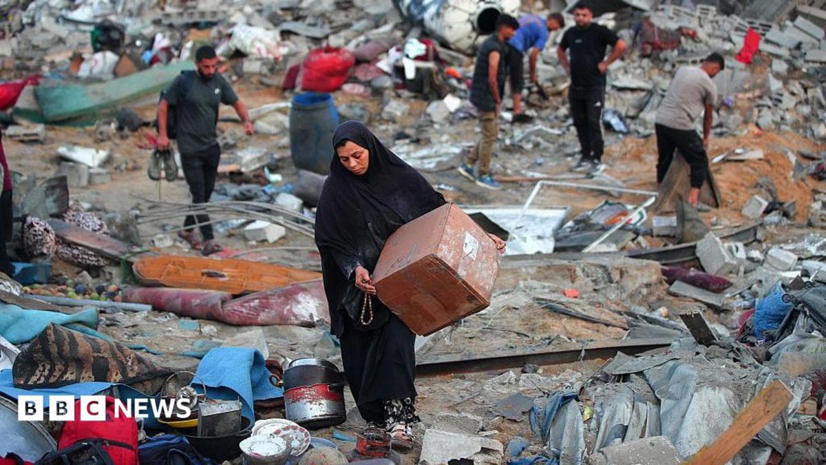Palestinians in Gaza retrieve belongings after Israeli air strike