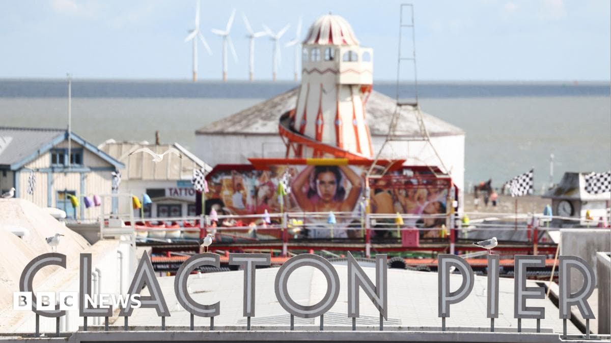 Clacton Pier with helter-skelter and rides in the distance