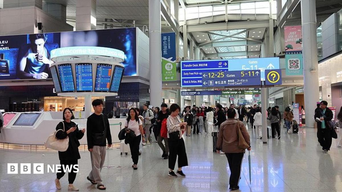 Passengers walking in the departure hall at Incheon airport