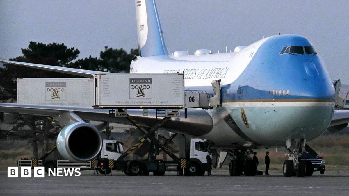 A catering truck parked alongside the old Air Force One jet prior to departure from Ankara
