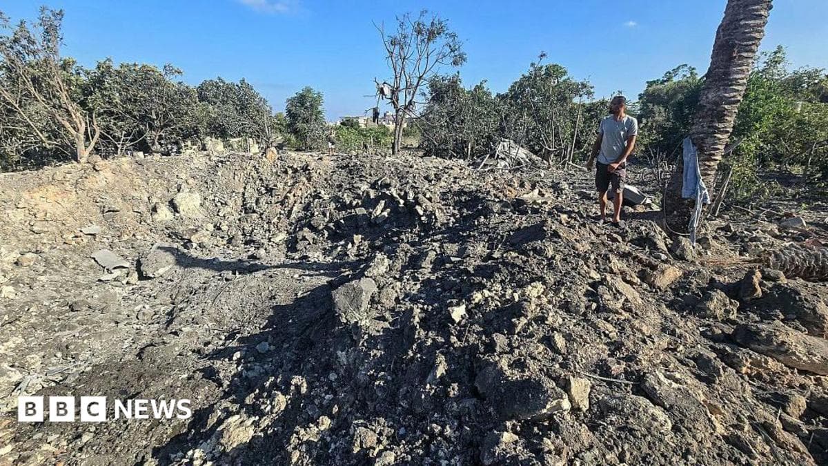 A man stands by a crater left by an overnight Israeli air strike on a house in the area of Burj al-Shamali, near Tyre, southern Lebanon (6 August 2026)