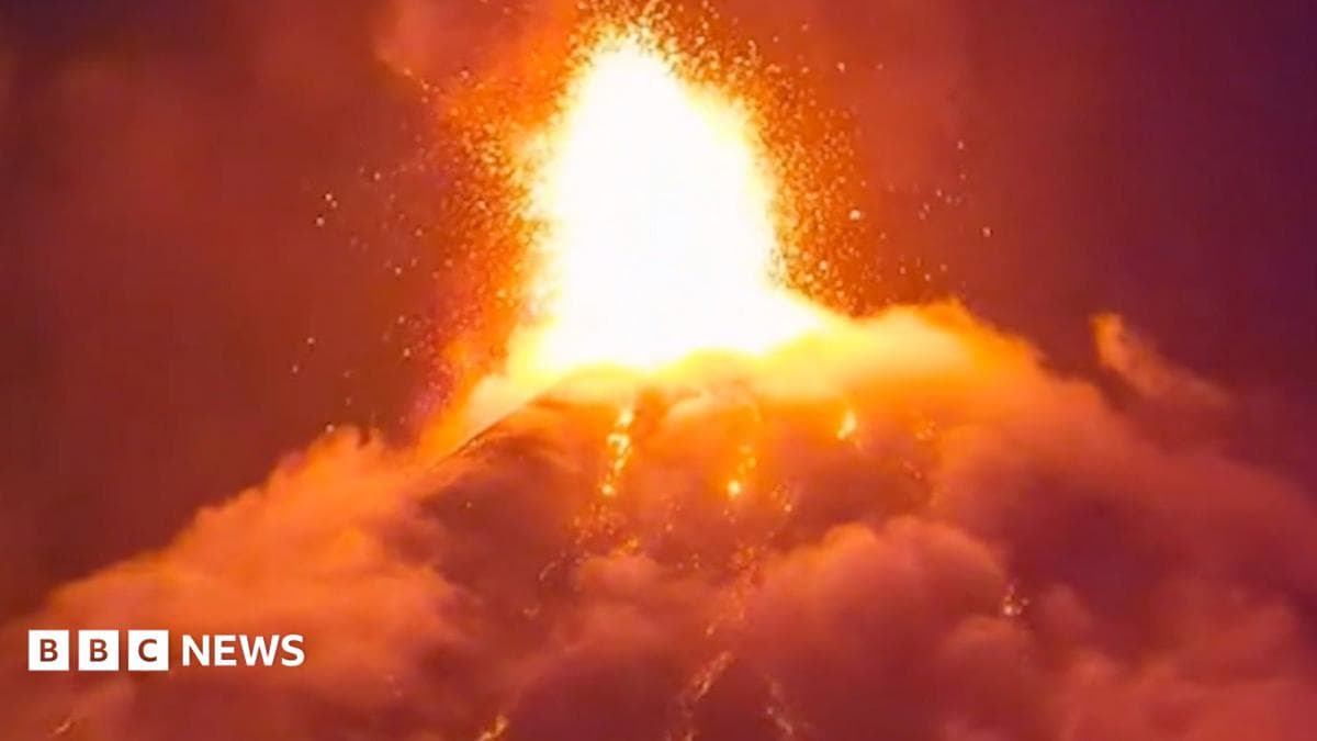 Orange lava erupts into the night sky