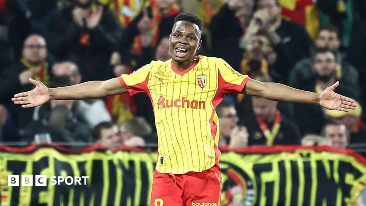 Mamadou Sangare pictured with his arms outstretched while playing for Lens