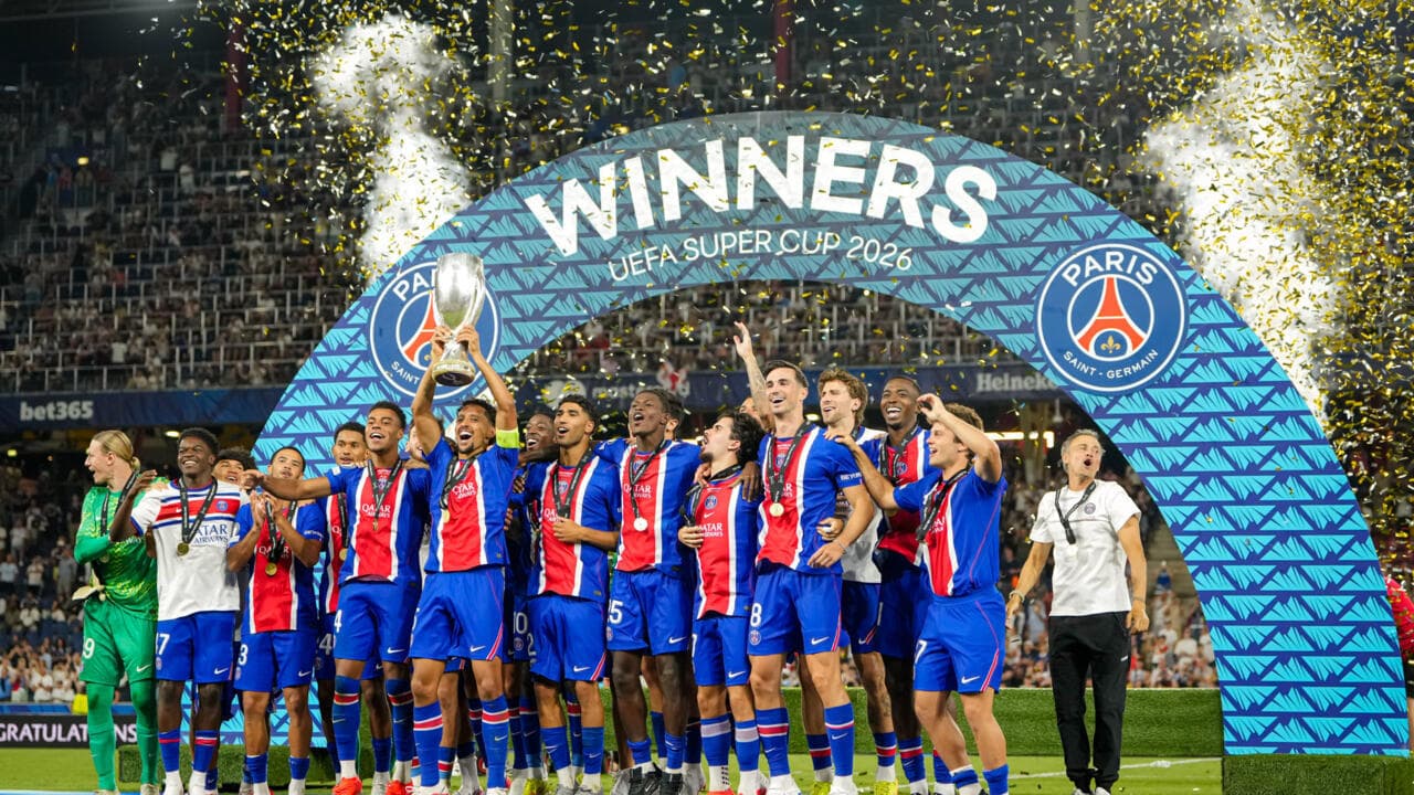 PSG's Marquinhos lifts the trophy during celebrations at the end of the UEFA Super Cup soccer match between Paris Saint-Germain and Aston Villa in Salzburg, Austria, Wednesday, Aug.12, 2026. (AP Photo/Darko Bandic)