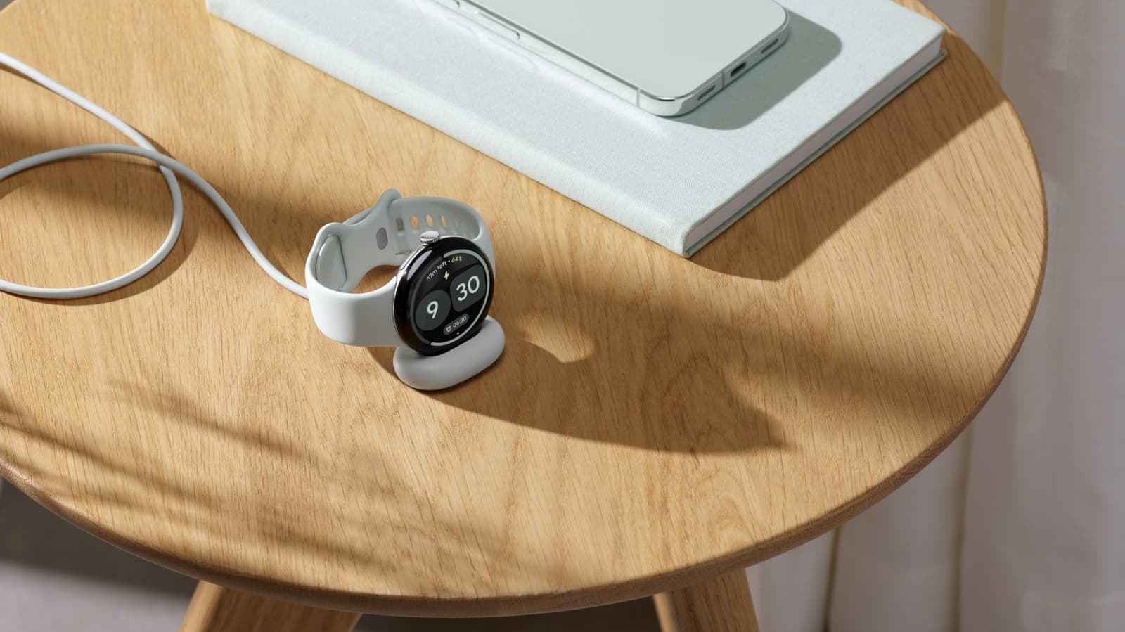 Pixel Watch 5 on a nightstand.